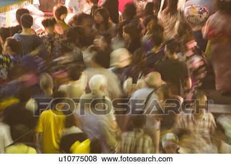 Group of people visiting summer festival in Japan View Large Photo Image Stock Photo - Group of people visiting summer festival in Japan. Fotosearch