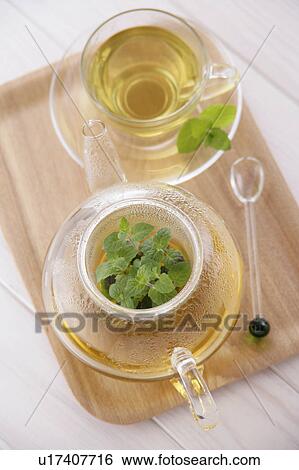 Herbal tea in glass teapot, high angle view View Large Photo Image Stock Photograph - Herbal tea in glass teapot, high angle view. Fotosearch