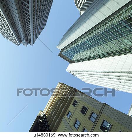 Stock Photo - High-rise buildings in Osaka, Japan, low angle view. Fotosearch