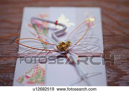 Stock Photo - Japanese ceremonial paper cord, close-up. Fotosearch