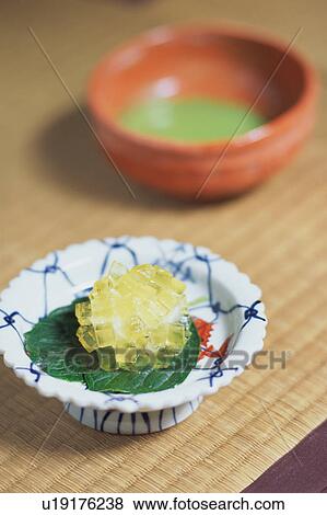Stock Photo - Japanese sweets and a cup of green tea. Fotosearch
