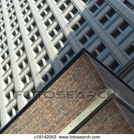 Stock Image - Low angle view of an office building in Osaka, Japan. Fotosearch