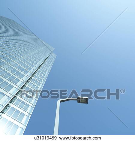 Stock Photo - Low angle view of office building in Osaka, Japan. Fotosearch