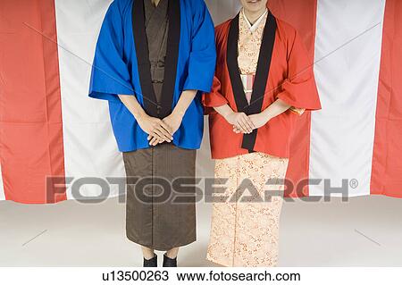 Man and woman wearing kimono View Large Photo Image Stock Image - Man and woman wearing kimono. Fotosearch
