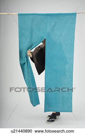 Man pushing past curtain View Large Photo Image Stock Image - Man pushing past curtain. Fotosearch