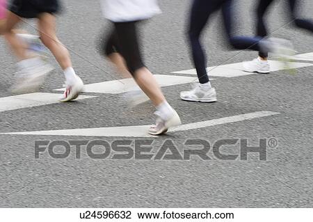 Stock Image - Marathon Athletes, blurred motion. Fotosearch