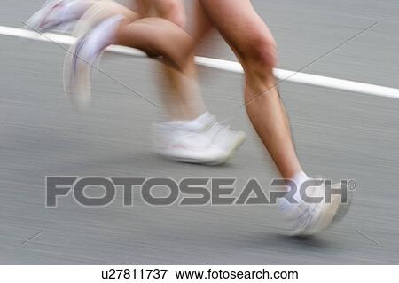 Marathon Athletes, blurred motion View Large Photo Image Stock Photo - Marathon Athletes, blurred motion. Fotosearch