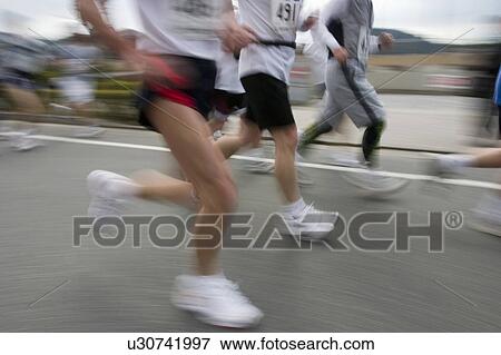 Marathon Athletes, blurred motion View Large Photo Image Stock Photo - Marathon Athletes, blurred motion. Fotosearch