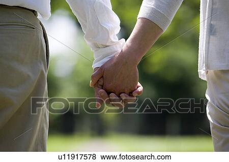 Mature couple holding hands View Large Photo Image Stock Photo - Mature couple holding hands. Fotosearch