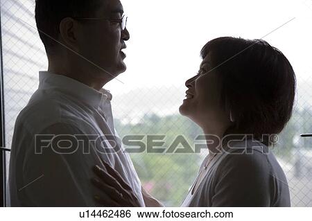 Stock Photograph - Mature couple looking at each other. Fotosearch
