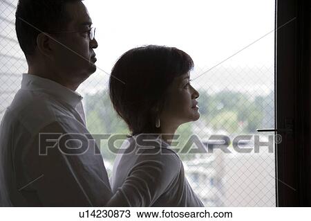 Mature couple looking outside from balcony View Large Photo Image Stock Image - Mature couple looking outside from balcony. Fotosearch