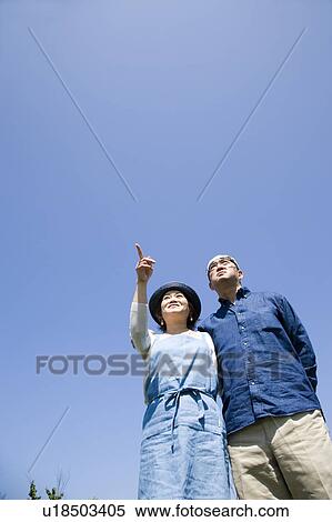 Stock Photography - Mature couple standing side by side. Fotosearch
