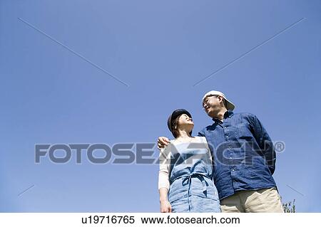 Stock Photography - Mature couple standing side by side. Fotosearch
