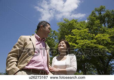 Mature couple walking View Large Photo Image Stock Photo - Mature couple walking. Fotosearch