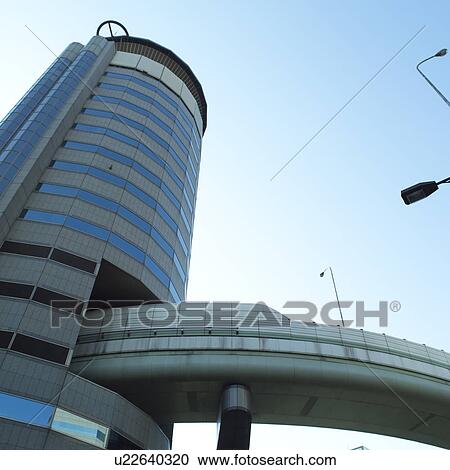 Motorway coming out of a building in Osaka, Japan View Large Photo Image Stock Image - Motorway coming out of a building in Osaka, Japan. Fotosearch