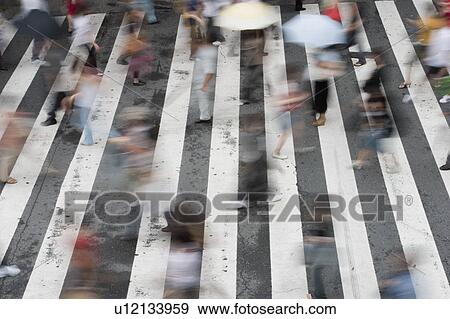 People crossing street in Japan View Large Photo Image Stock Photo - People crossing street in Japan. Fotosearch