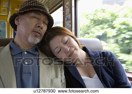 Senior couple sleeping in train View Large Photo Image Stock Image - Senior couple sleeping in train. Fotosearch