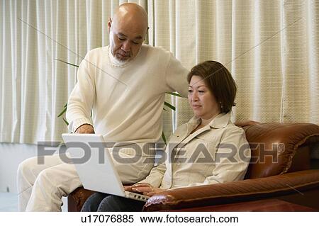 Stock Photography - Senior couple using computer. Fotosearch