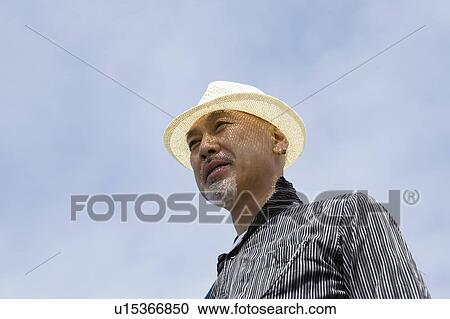 Stock Image - Senior man wearing hat. Fotosearch