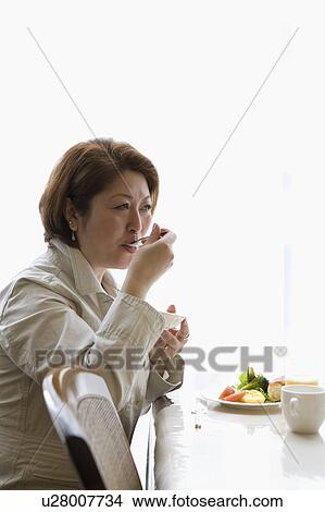 Senior woman having breakfast View Large Photo Image Picture - Senior woman having breakfast. Fotosearch