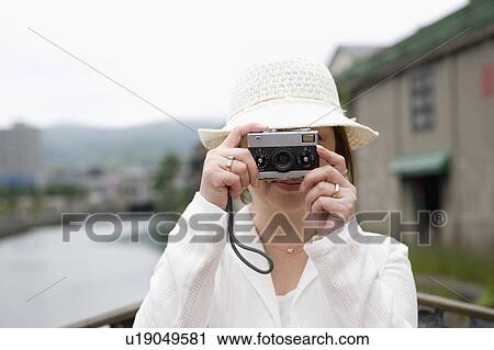 Senior woman taking photograph View Large Photo Image Stock Image - Senior woman taking photograph. Fotosearch