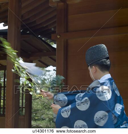 Shinto priest praying View Large Photo Image Stock Photograph - Shinto priest praying. Fotosearch
