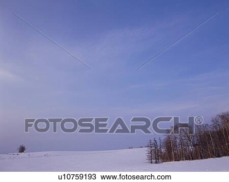 Stock Image - Snow-covered field in Hokkaido, Japan. Fotosearch