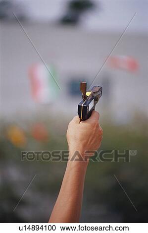 Stock Image - Starting gun at school sports day. Fotosearch