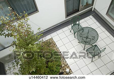 Table and chairs at porch View Large Photo Image Stock Image - Table and chairs at porch. Fotosearch
