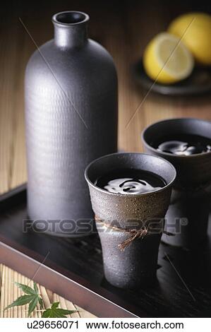 Stock Image - Two cups of shochu. Fotosearch