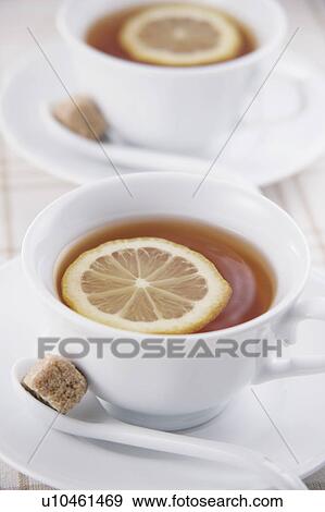 Stock Photo - Two cups of tea with lemon. Fotosearch