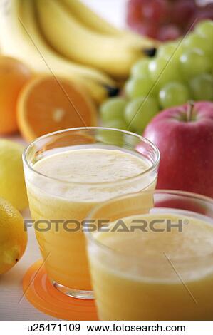 Two glasses of fruit juice View Large Photo Image Stock Photo - Two glasses of fruit juice. Fotosearch