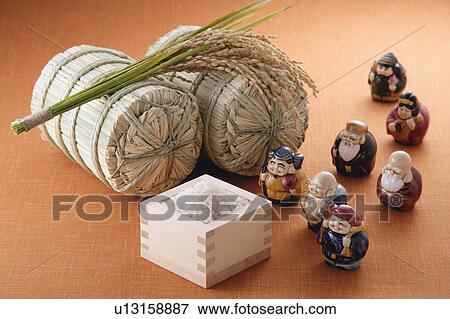 Stock Photo - Uncooked rice and figurines. Fotosearch