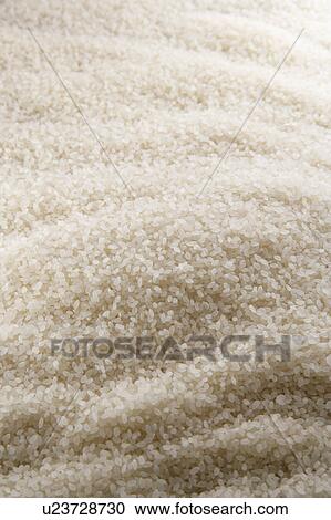 Stock Image - Uncooked rice, close-up. Fotosearch