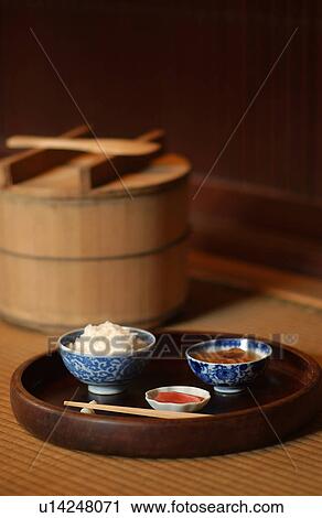 Stock Image - White rice and side dishes. Fotosearch