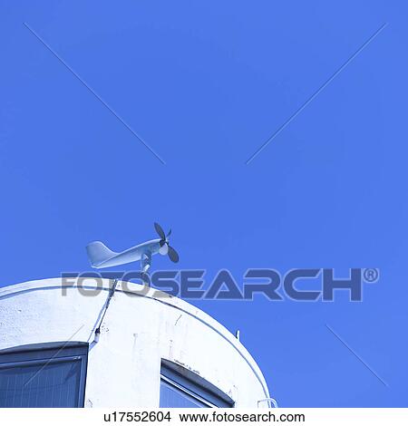 Wind meter attached to top of a building View Large Photo Image Picture - Wind meter attached to top of a building. Fotosearch