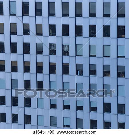 Stock Photograph - Windows of office building in Shinjuku, Tokyo, Japan. Fotosearch
