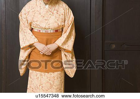 Woman wearing kimono with apron View Large Photo Image Stock Photo - Woman wearing kimono with apron. Fotosearch