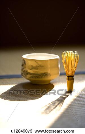 Stock Image - Bamboo Whisk and a Ceramic Bowl on Tatami. Fotosearch