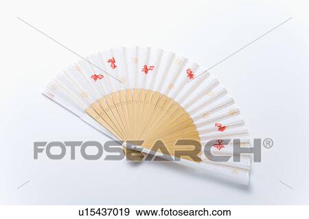 Stock Photo - Japanese folding fan, high angle view, white background. Fotosearch