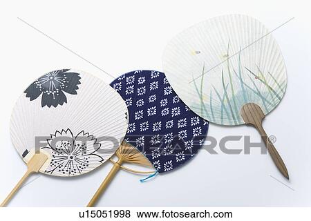 Stock Photo - Three Japanese fans, high angle view, white background. Fotosearch