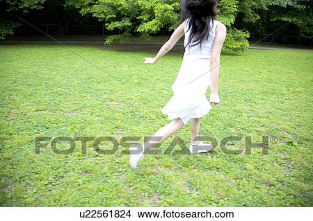 Back of woman running in the park View Large Photo Image Picture - Back of woman running in the park. Fotosearch