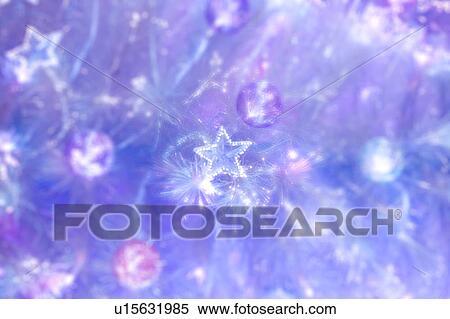 Stock Photography - Blue star lights on a Christmas tree. Fotosearch
