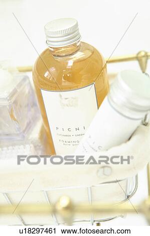 Stock Image - Bottle in bathroom basket. Fotosearch