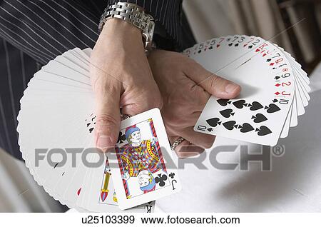 Stock Photo - Card trick. Fotosearch