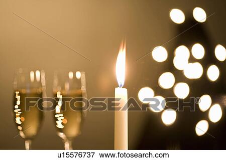 Stock Photo - Champagne and Candle. Fotosearch