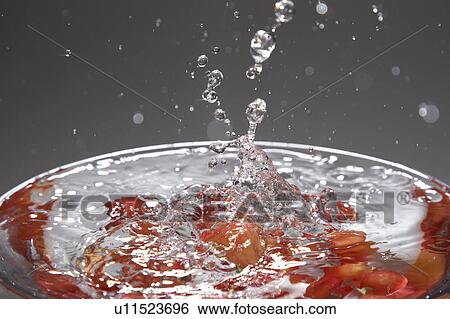 Cherry dropping into glass View Large Photo Image Stock Photograph - Cherry dropping into glass. Fotosearch