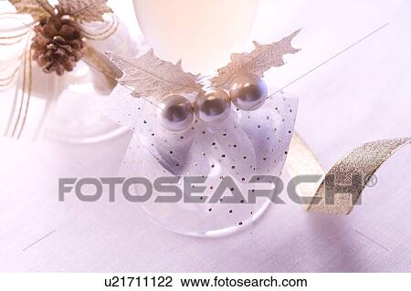 Christmas bell decorations on champagne glasses View Large Photo Image Stock Image - Christmas bell decorations on champagne glasses. Fotosearch