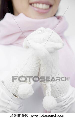 Stock Image - Close-up of woman's gloved hands. Fotosearch