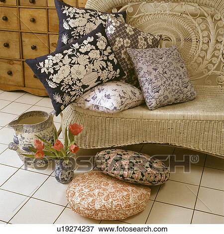 Cushions and pillows on a wicker chair View Large Photo Image Stock Photo - Cushions and pillows on a wicker chair. Fotosearch